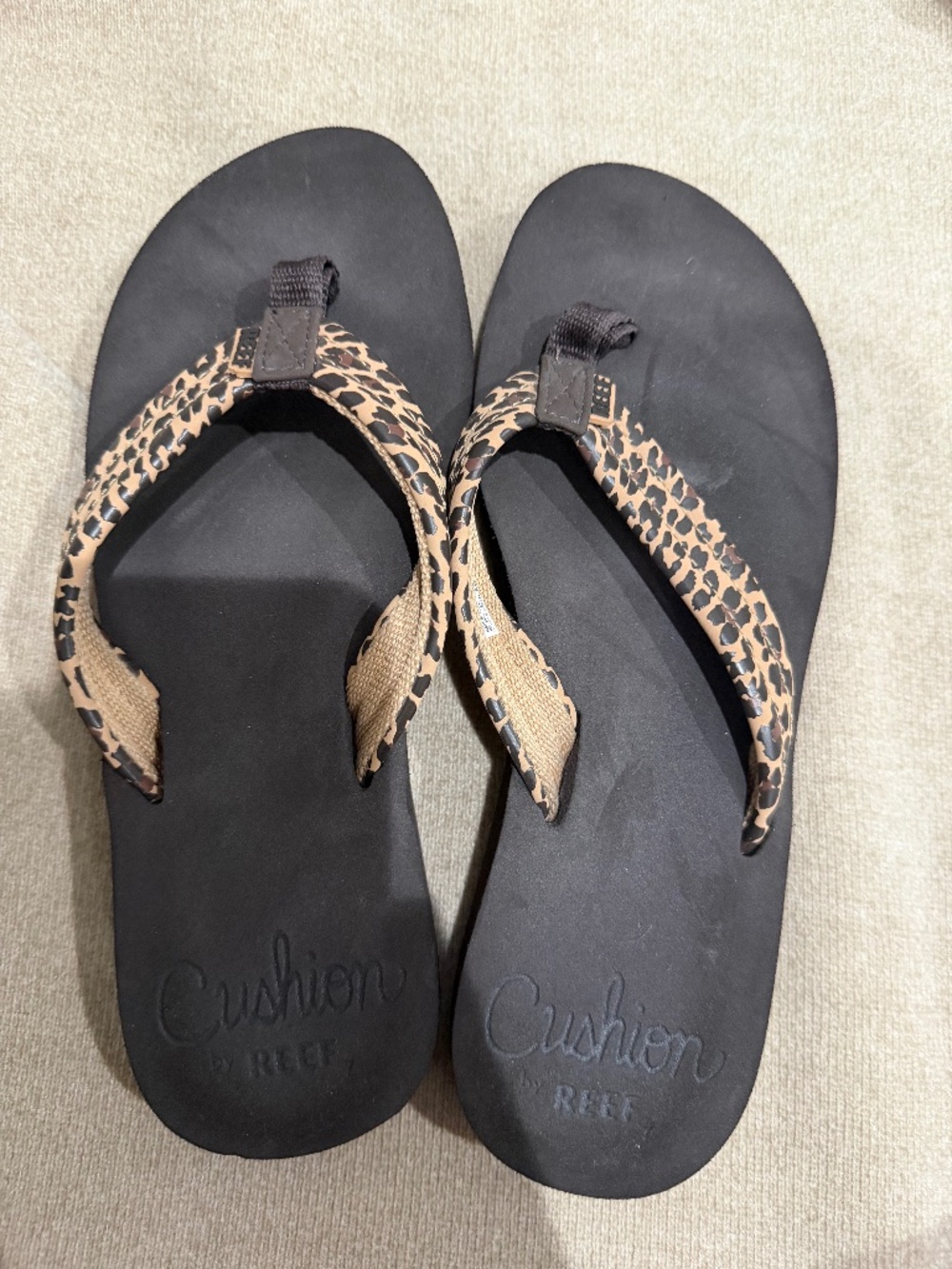 Reef Cushion cheetah print flip flops